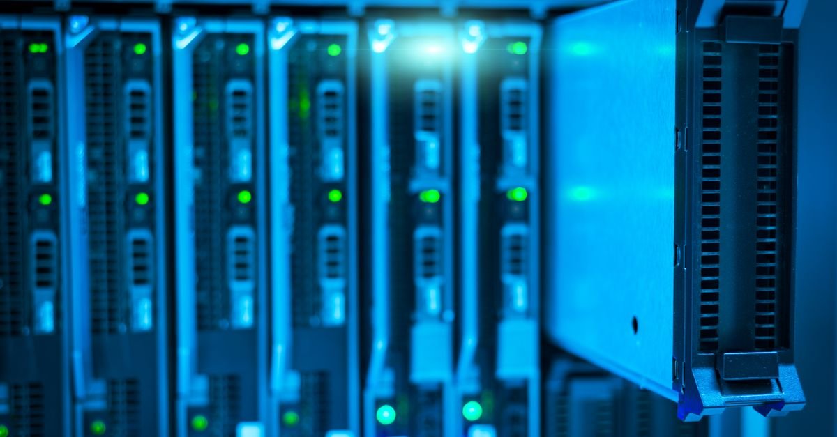 Server rack with glowing green indicator lights in data center